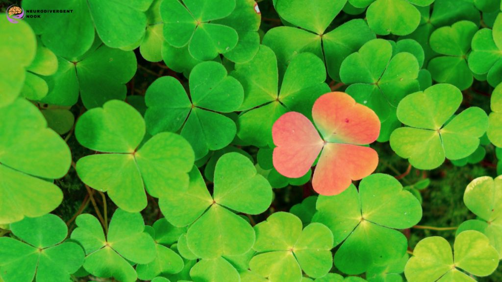 Red leaves in amongst a lot of green once signifying difference